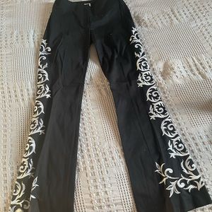 Cache black pants with white detail on sides. New with tags size 2